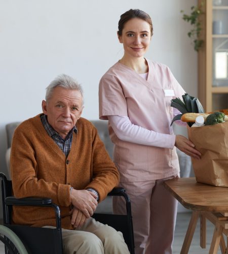 portrait-of-disabled-senior-man-with-female-caregiver.jpg